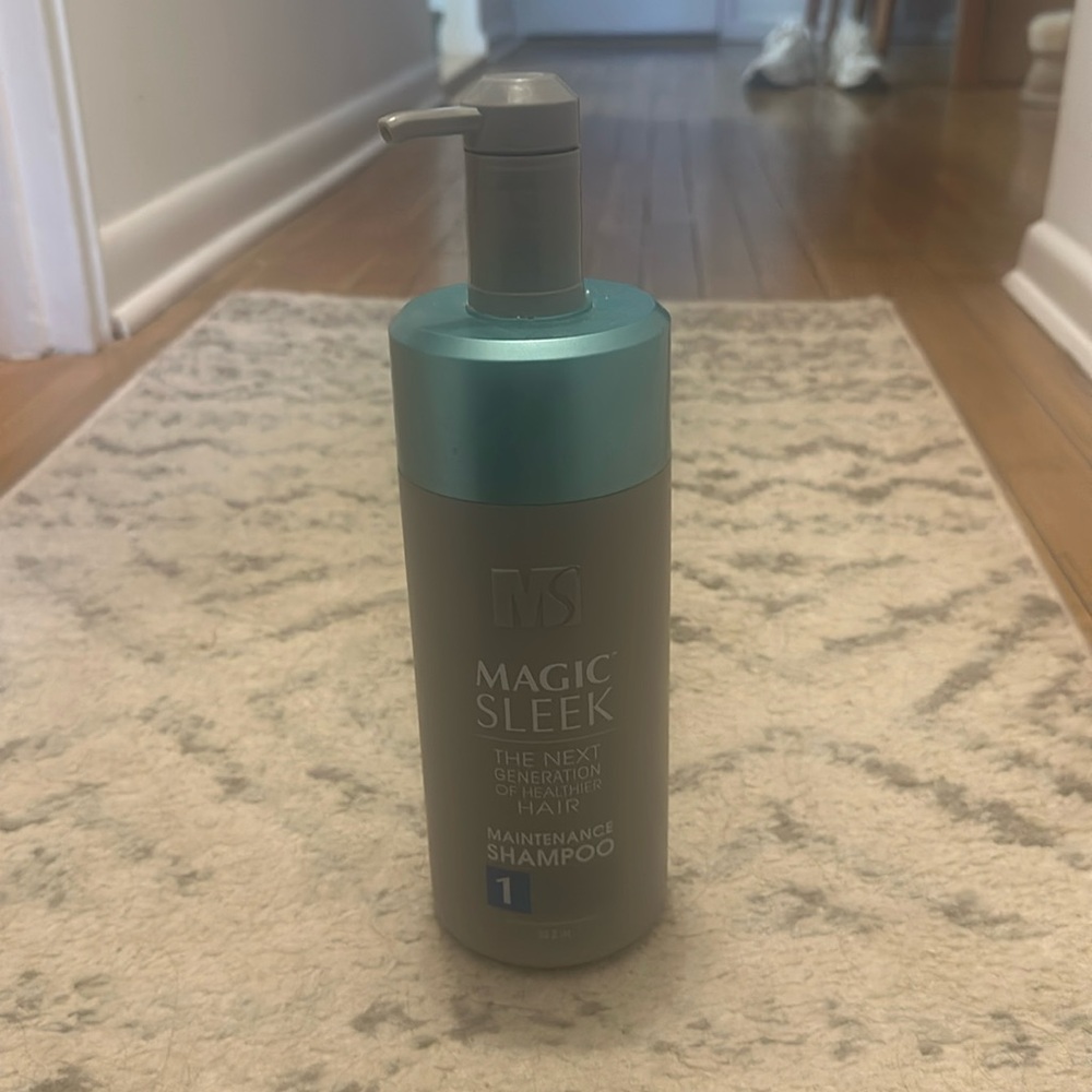 Magic sleek shampoo bottle is 2/3 full.
